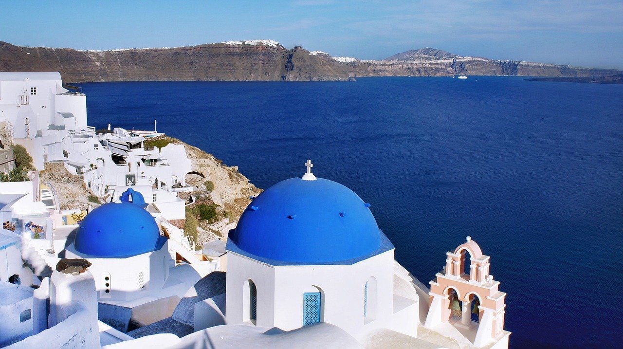 Whitewashed Santorini village at golden hour